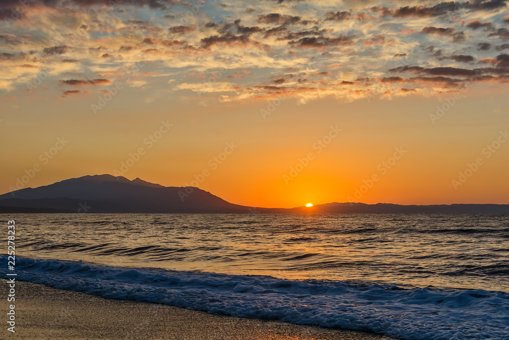 Fototapeta premium Early morning , dramatic sunrise over sea and mountain. Photographed in Asprovalta, Greece.