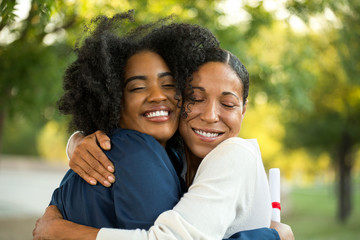 Mother and her daughter hugging at her graduation.