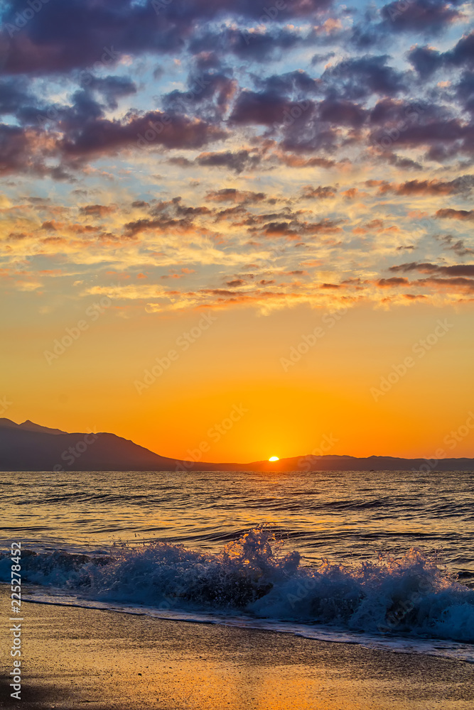 Naklejka premium Early morning , dramatic sunrise over sea and mountain. Photographed in Asprovalta, Greece.