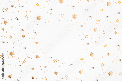 Christmas composition. Christmas golden decorations on white background. Flat lay, top view, copy space photo