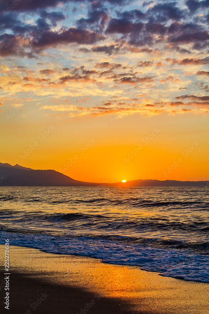 Naklejka premium Early morning , dramatic sunrise over sea and mountain. Photographed in Asprovalta, Greece.