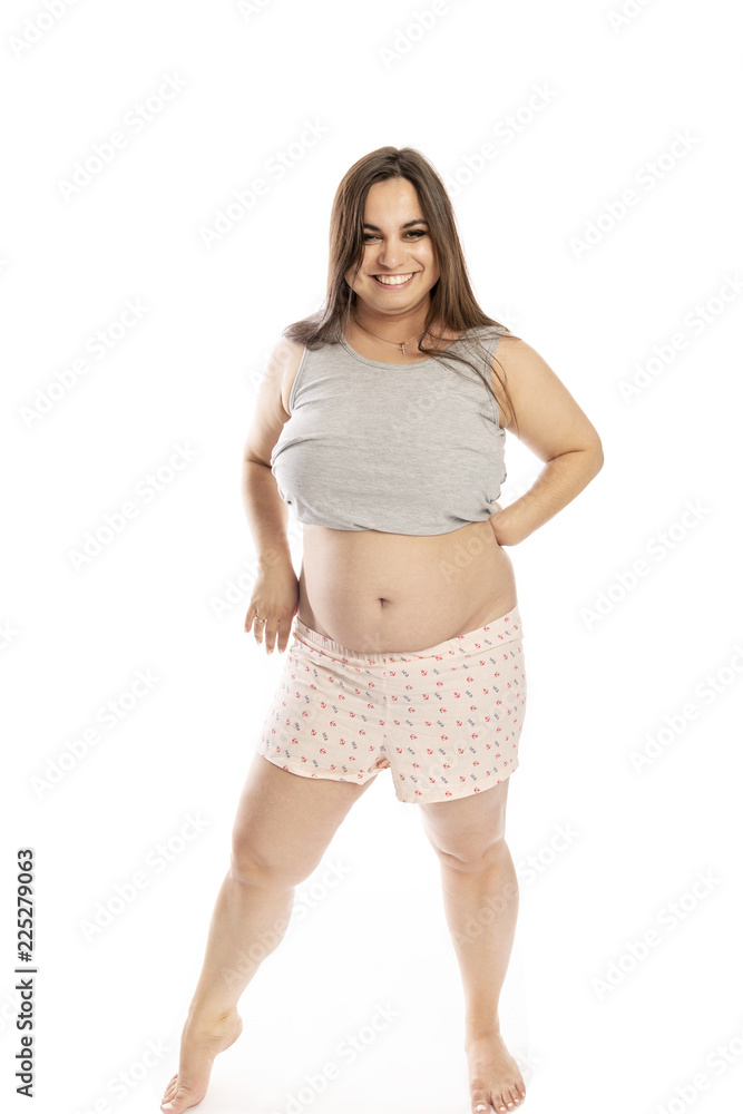 Thik young woman laughing and dansing, isolated on white background Thik young woman laughing and dansing, isolated on white background