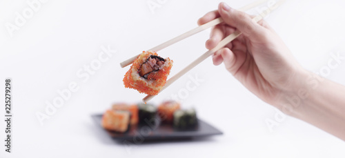 Sushi rolls with white sticks. Japanese cuisine.