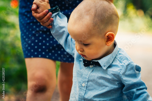 happy mother and toddler son on nature background