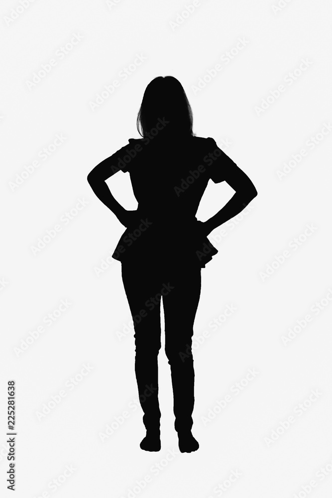 Motion concept - Young woman standing akimbo on white background.