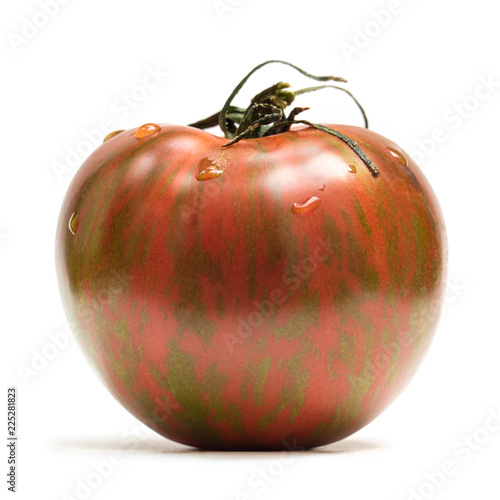 Organic red zebra tomato isolated on white background