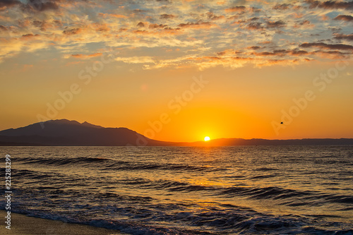 Early morning   dramatic sunrise over sea and mountain. Photographed in Asprovalta  Greece.