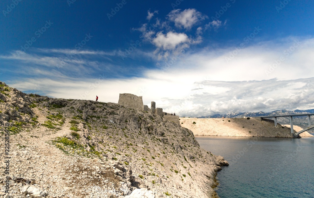 Ruine of fortress and the Pag bridge, Island of Pag, Croatia