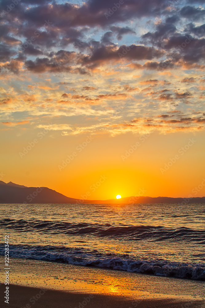 Early morning , dramatic sunrise over sea and mountain. Photographed in Asprovalta, Greece.