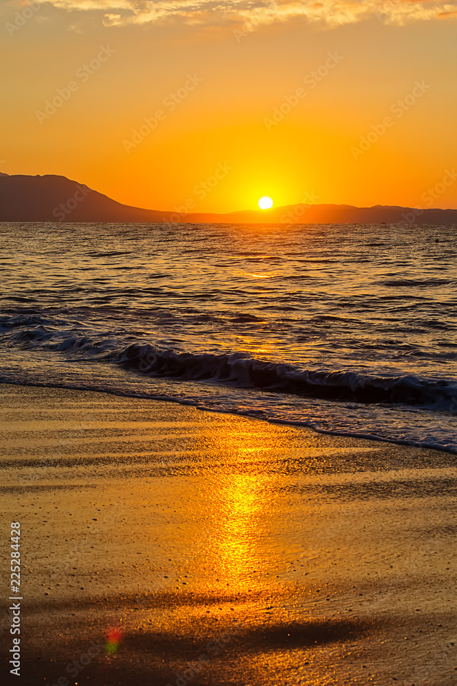 Naklejka premium Early morning , dramatic sunrise over sea and mountain. Photographed in Asprovalta, Greece.