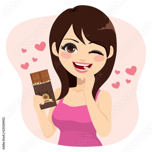 Lovely brunette woman eating chocolate bar naughty face expression