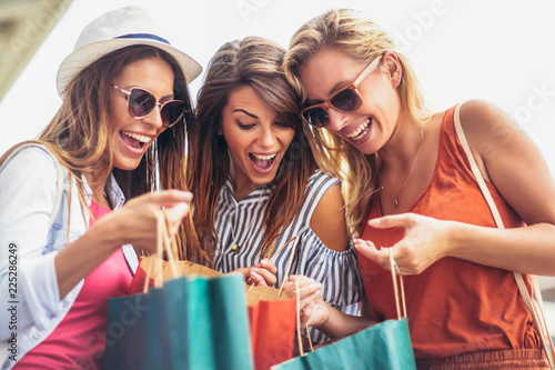 Beautiful woman with shopping bags in the city-sale, shopping, tourism and happy people concept
