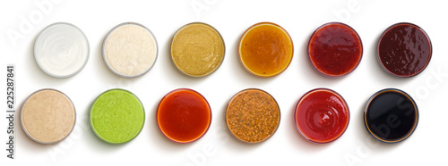 Schilderij op canvas Different sauces isolated on white background, top view
