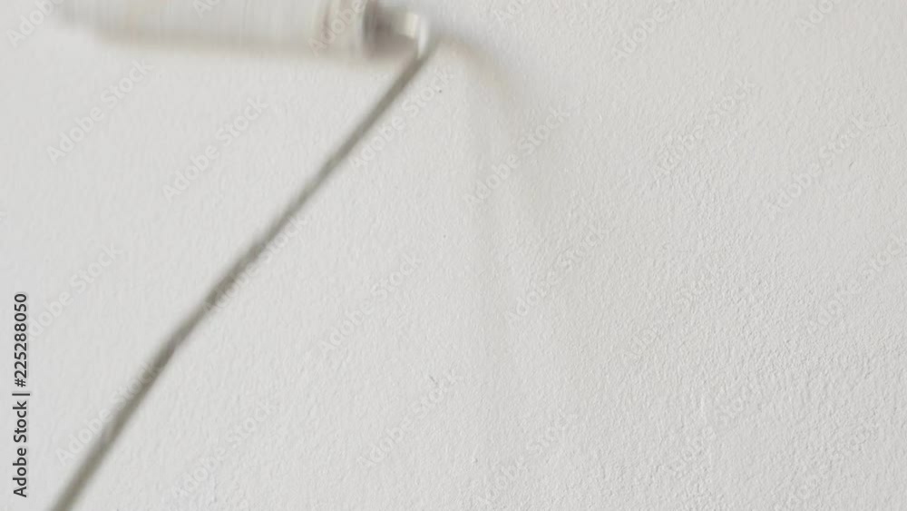 Spreading of white paint on wall surface 4K footage Spreading of white paint on wall surface 4K footage