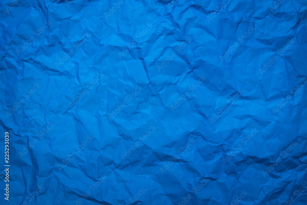 Crumpled of blue paper sheet texture background. Abstract wallpaper in