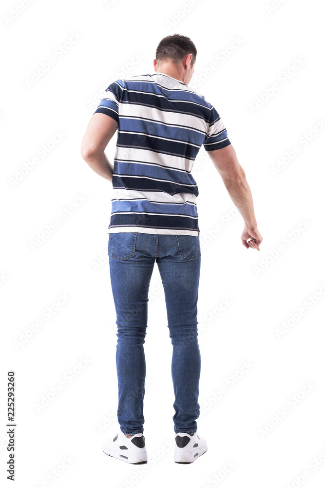 Back view of casual man pointing finger down as he found something concept. Full body isolated on white background. Back view of casual man pointing finger down as he found something concept. Full body isolated on white background.