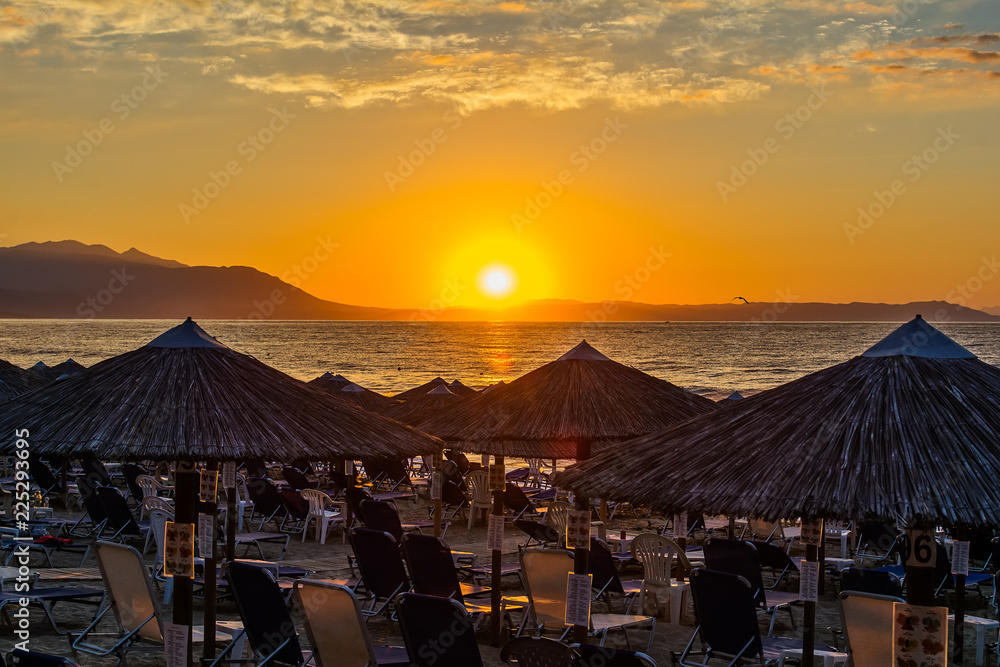 Fototapeta premium View of the sunrise through a local restaurant