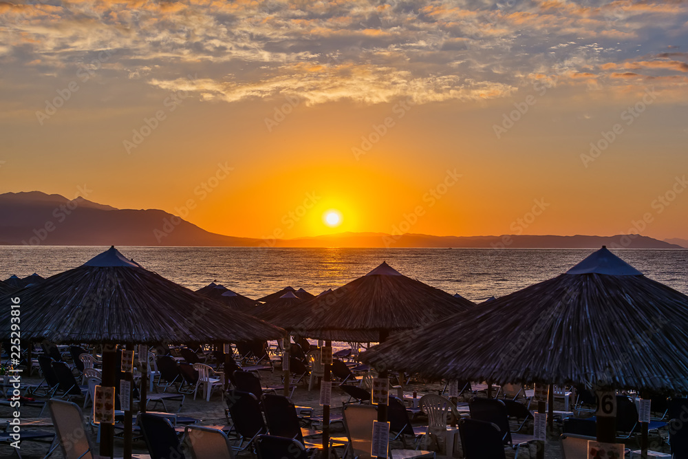 Naklejka premium View of the sunrise through a local restaurant