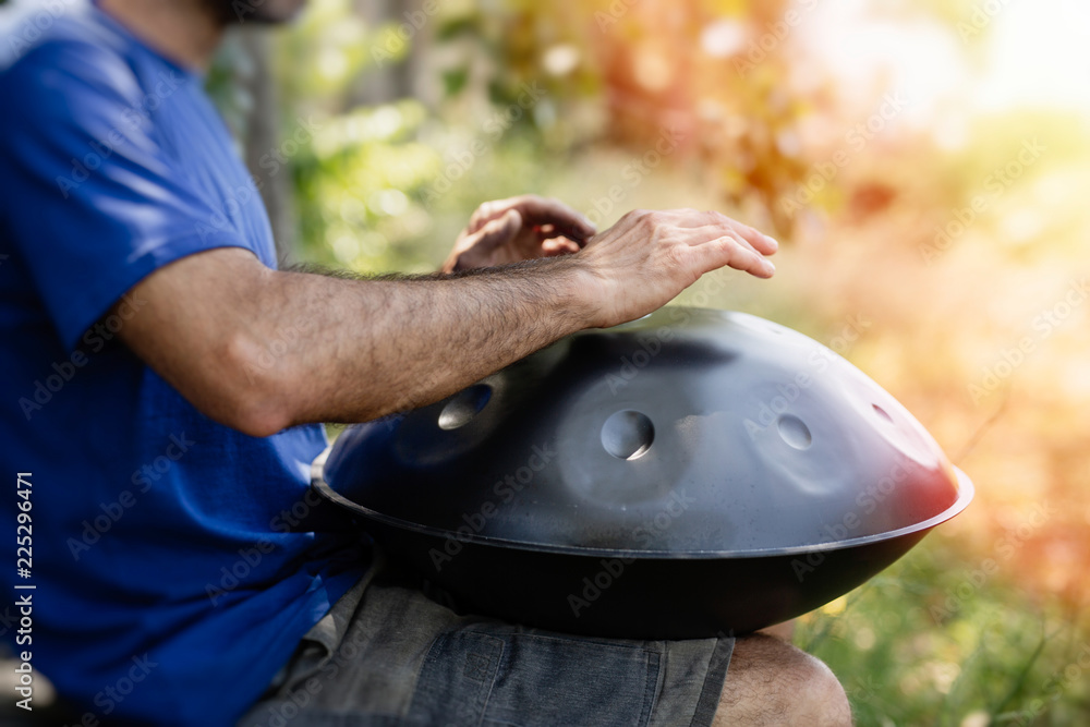 Man playing handpan