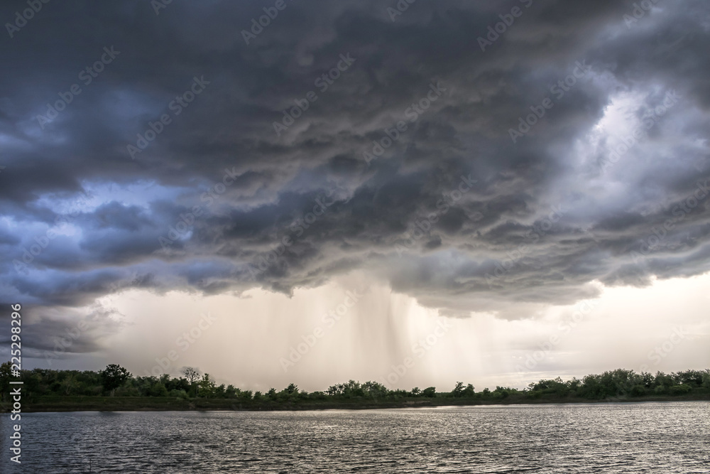 Light in the Dark and Dramatic Storm Clouds background