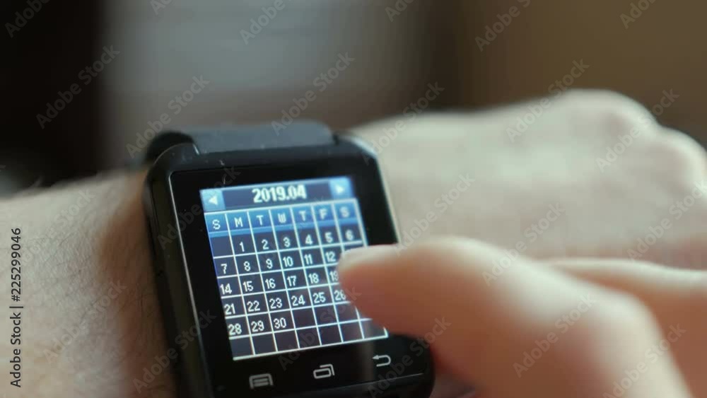 Man Using Calendar App Smart Watch to Check Schedule. Close up