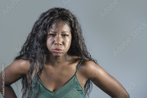 young beautiful and stressed black African American woman feeling upset and angry gesturing agitated and pissed looking crazy and furious arguing or having dispute photo