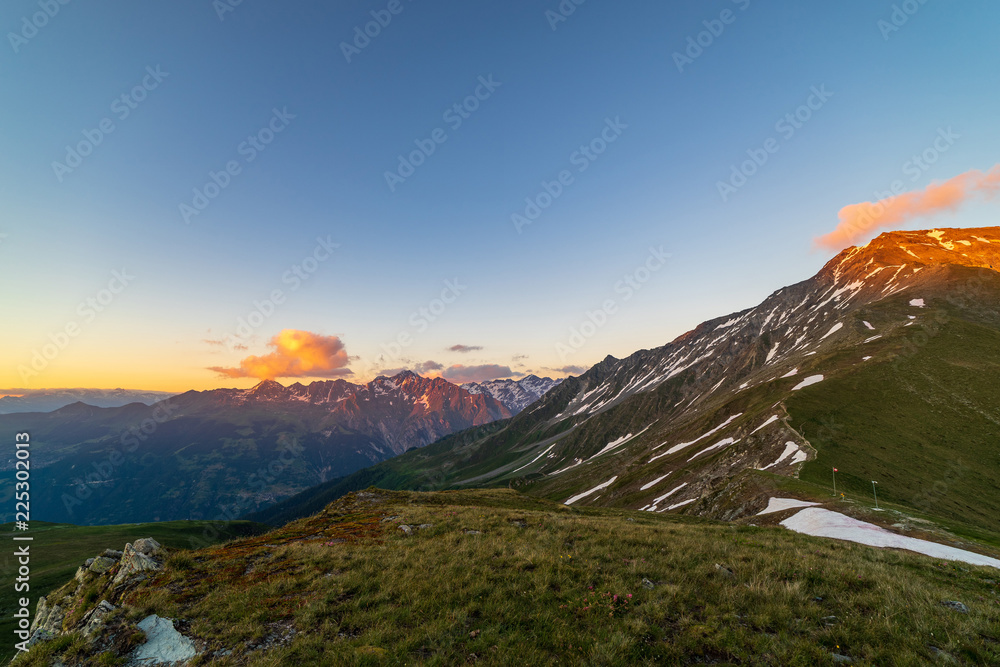 Fototapeta premium Scenic view of beautiful landscape of Swiss Alps in a Val De Bagnes area. Dramatic sunset scene in high mountains.