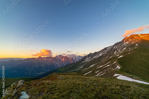 Scenic view of beautiful landscape of Swiss Alps in a Val De Bagnes area. Dramatic sunset scene in high mountains.