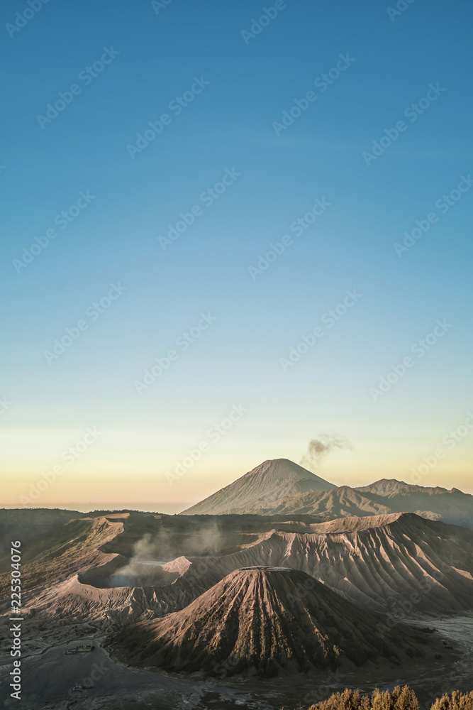 Mount Bromo volcano (Gunung Bromo) during sunrise from viewpoint on Mount Penanjakan. Mount Bromo volcano (Gunung Bromo) during sunrise from viewpoint on Mount Penanjakan.