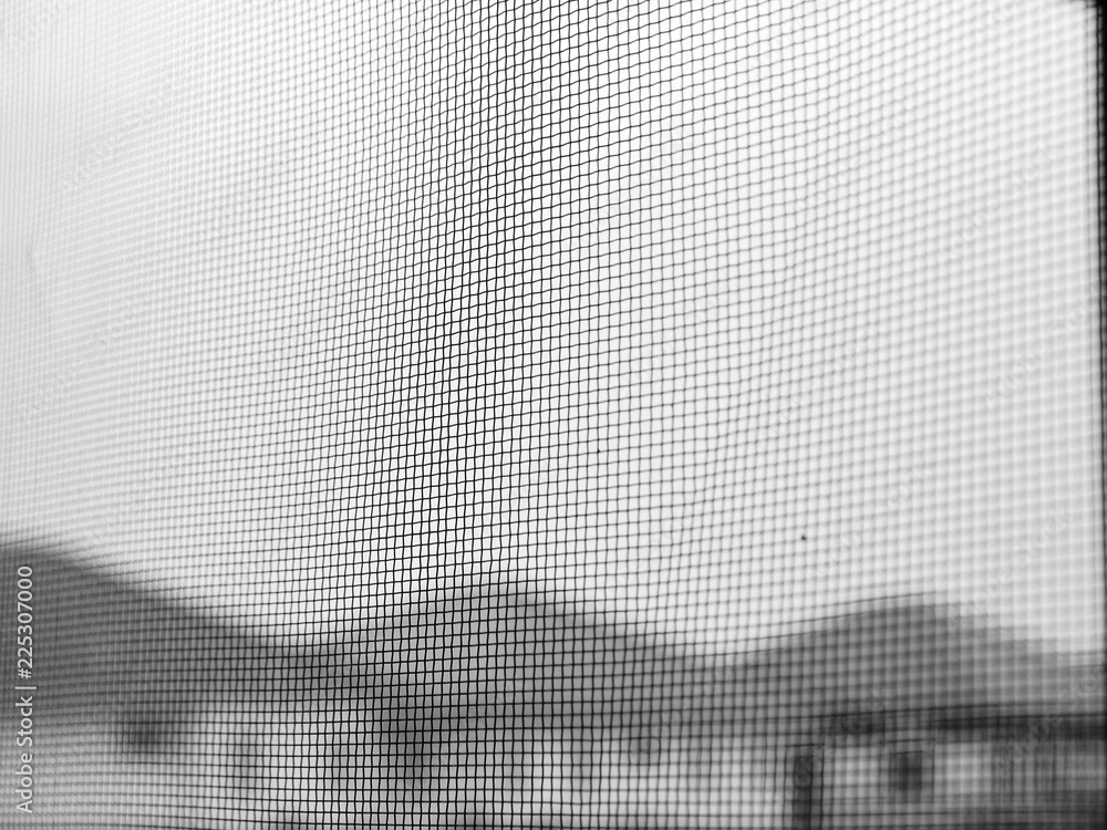 Mosquito wire screen texture on the window closeup Mosquito wire screen texture on the window closeup
