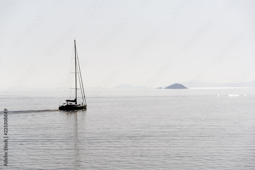 Fototapeta premium yacht in sea at sunset