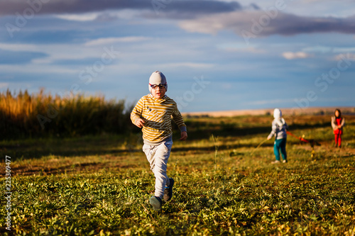 six-year-old kid running on the grass