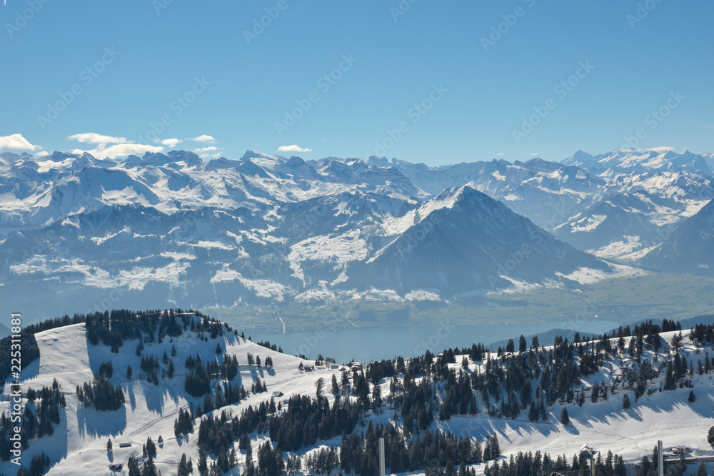 Beautiful view on snowy Swiss Alps as seen from top of Mount Rigi