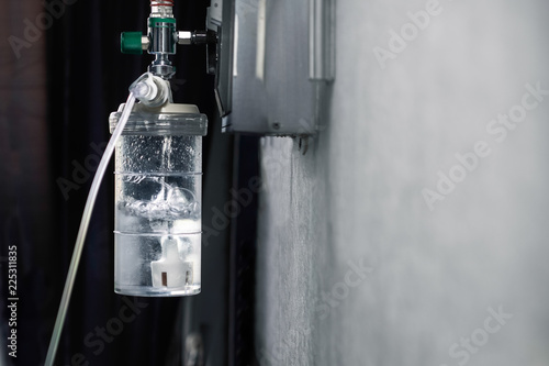 Oxygen regulator with humidifier medical equipment at hospital room photo