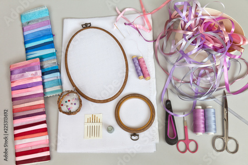 Accessories for embroidery with satin ribbons: needles, embroidery frame, a set of ribbons, canvases, scissors, thread, pins, thimble and satin ribbons of different colors