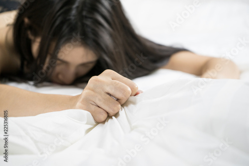 Tapeta woman having sex. Intimate young couple enjoying on bed.