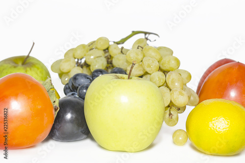 Fototapeta Naklejka Na Ścianę i Meble -  apple, persimmon, mandarin, plums, grapes