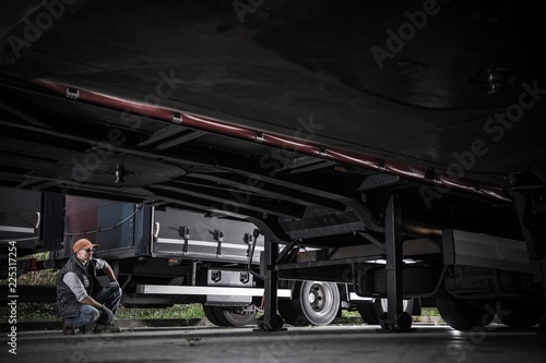 Trucker Checking Trailers