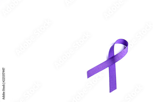 Purple awareness ribbon represents pancreatic cancer, alzheimer’s disease, lupus, animal abuse, ADD and religious tolerance. Isolated on white background, copy space, close up, top view, flat lay. photo