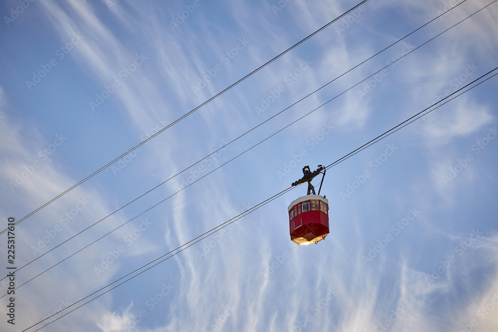 Cable car over a blue sky