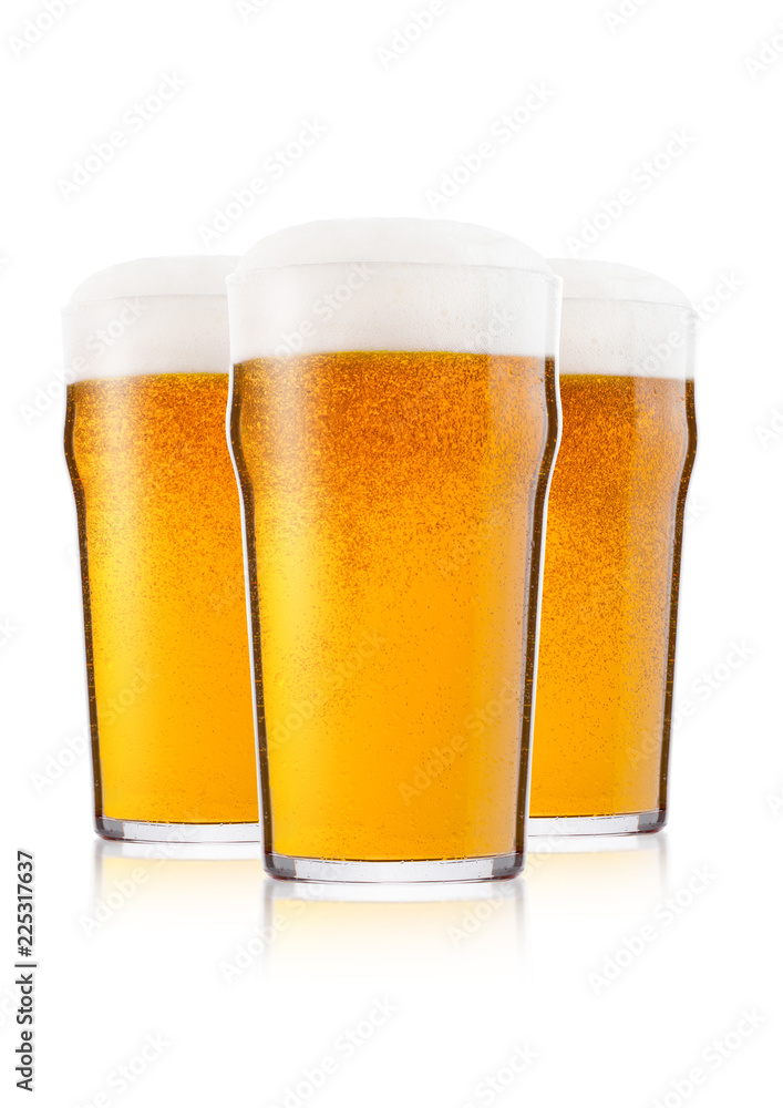 Cold glasses of lager beer with foam and dew Cold glasses of lager beer with foam and dew