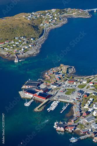 View from above of some villages on a small archipelago of Lofoten islands with mountain around it, Norway.