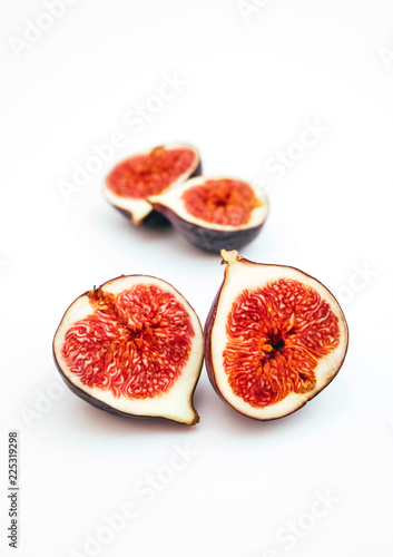 A set of ripe blue figs  whole  cut and sliced  isolated on white background. Healthy dieting concept.