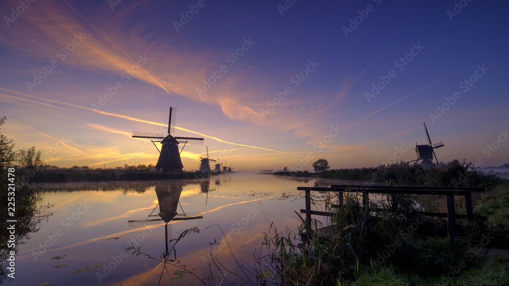 Early morning mist on an autumn morning in the Kinderdijk UNESCO Heritage centre of windmills near Rottterdam, Netherlands
