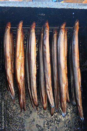 fresh smoked eels fish in oven. smokehouse.