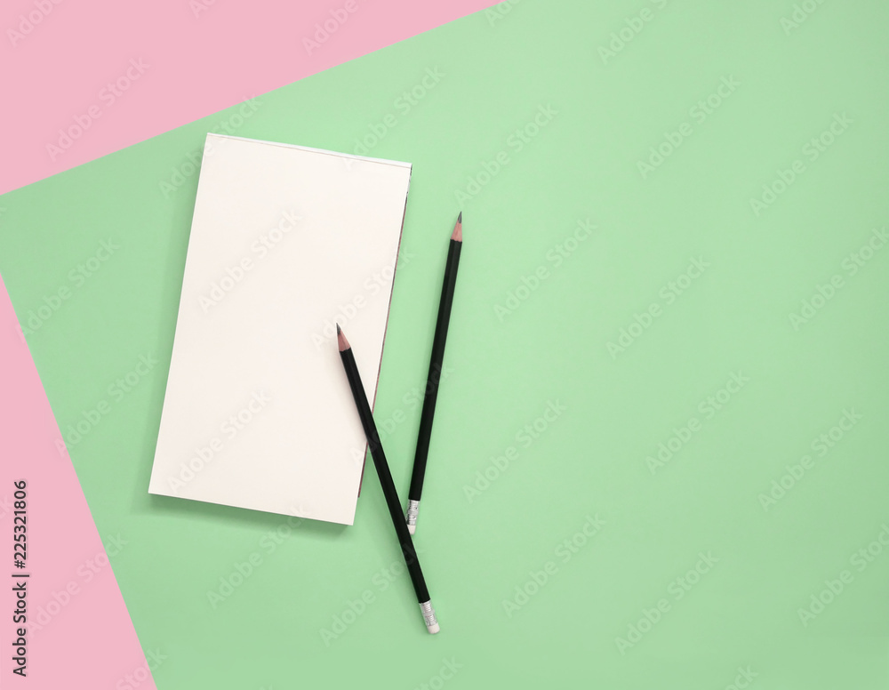 Empty notepad with pencils on color background. Empty notepad with pencils on color background.