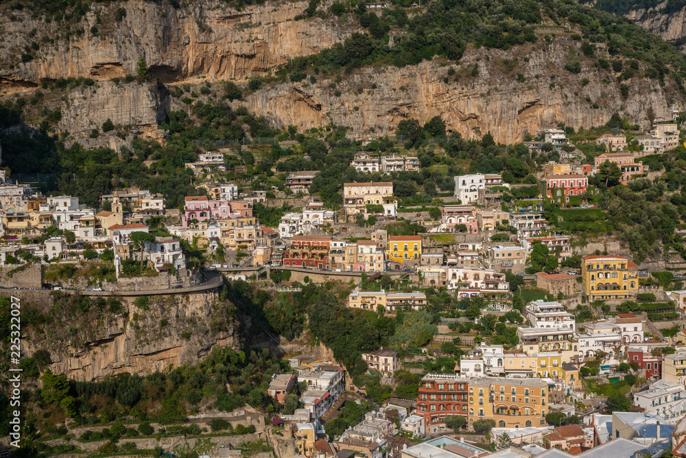 Positano - The magical beautiful village - View of the mountainside surrounded by beautiful Positano buildings in Italy