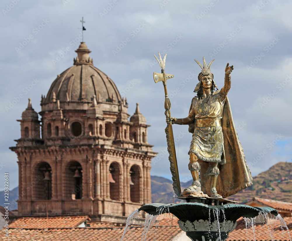 Obraz premium Statue of Pachacuti with Church of the Society of Jesus in background, Cusco, Peru
