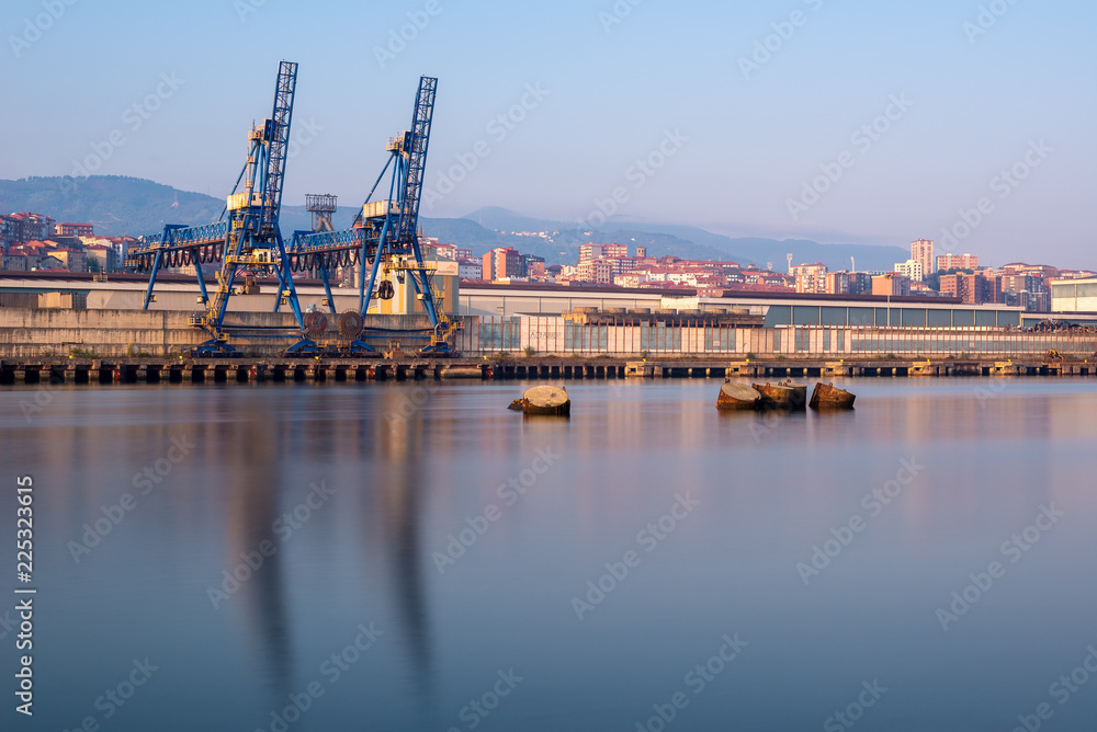 Cranes along the River Nervion in the industrial North of Bilbao, Basque Country, Spain