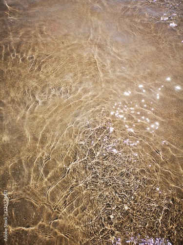 sparkling clear water on sand